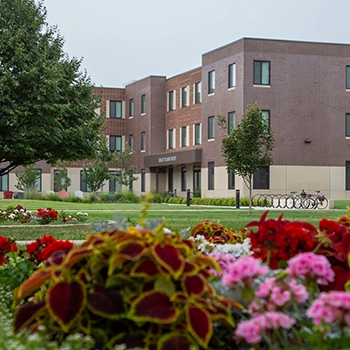 Campus building with flowers