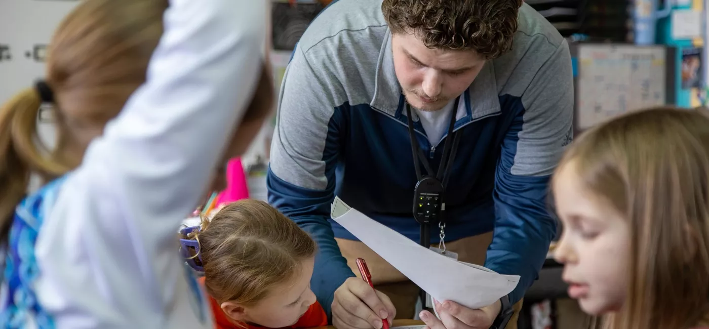 Teacher helping a student